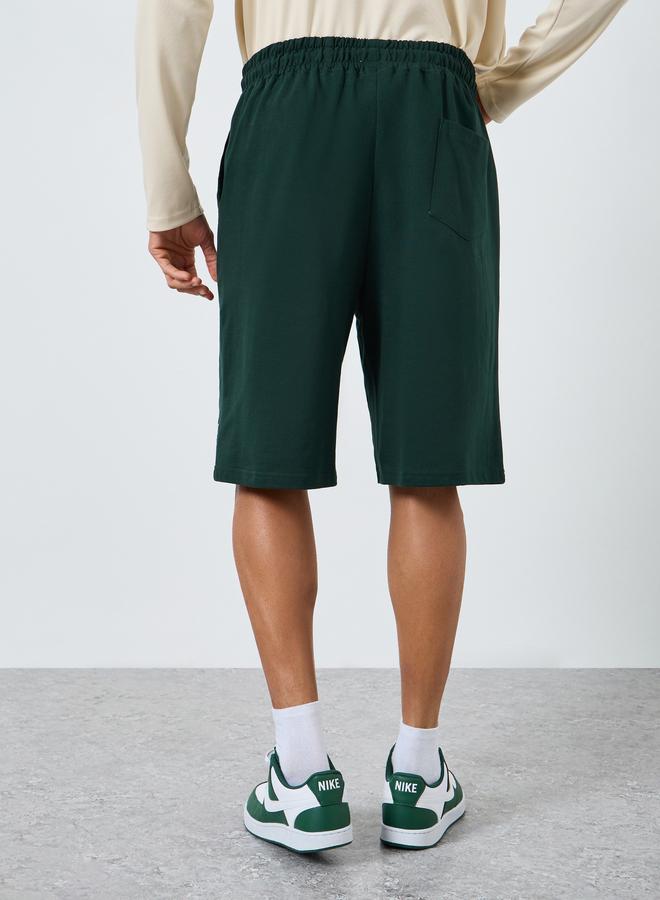 Styli Men Green Printed Oversized Shorts - Image 4